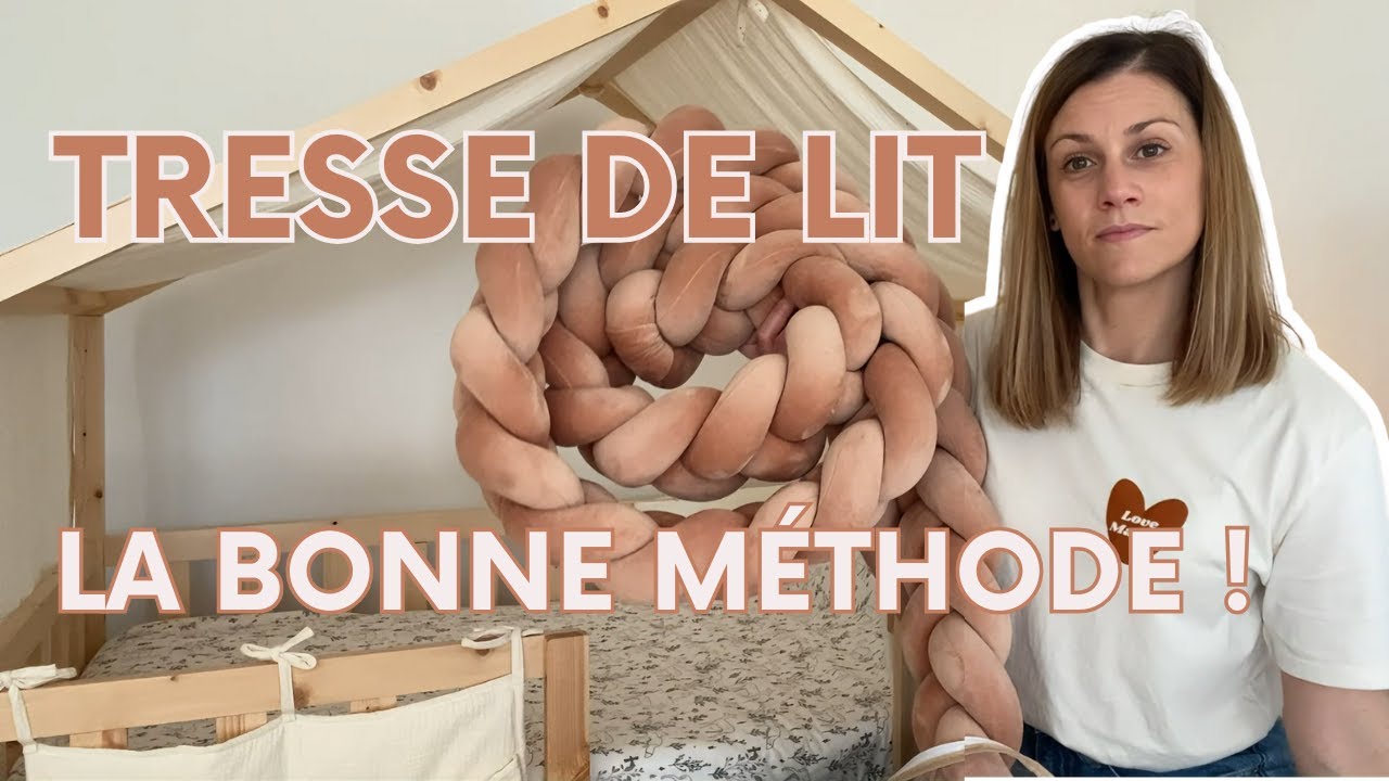 Tresse de lit tressée posée le long des barreaux d'un lit de bébé en bois clair